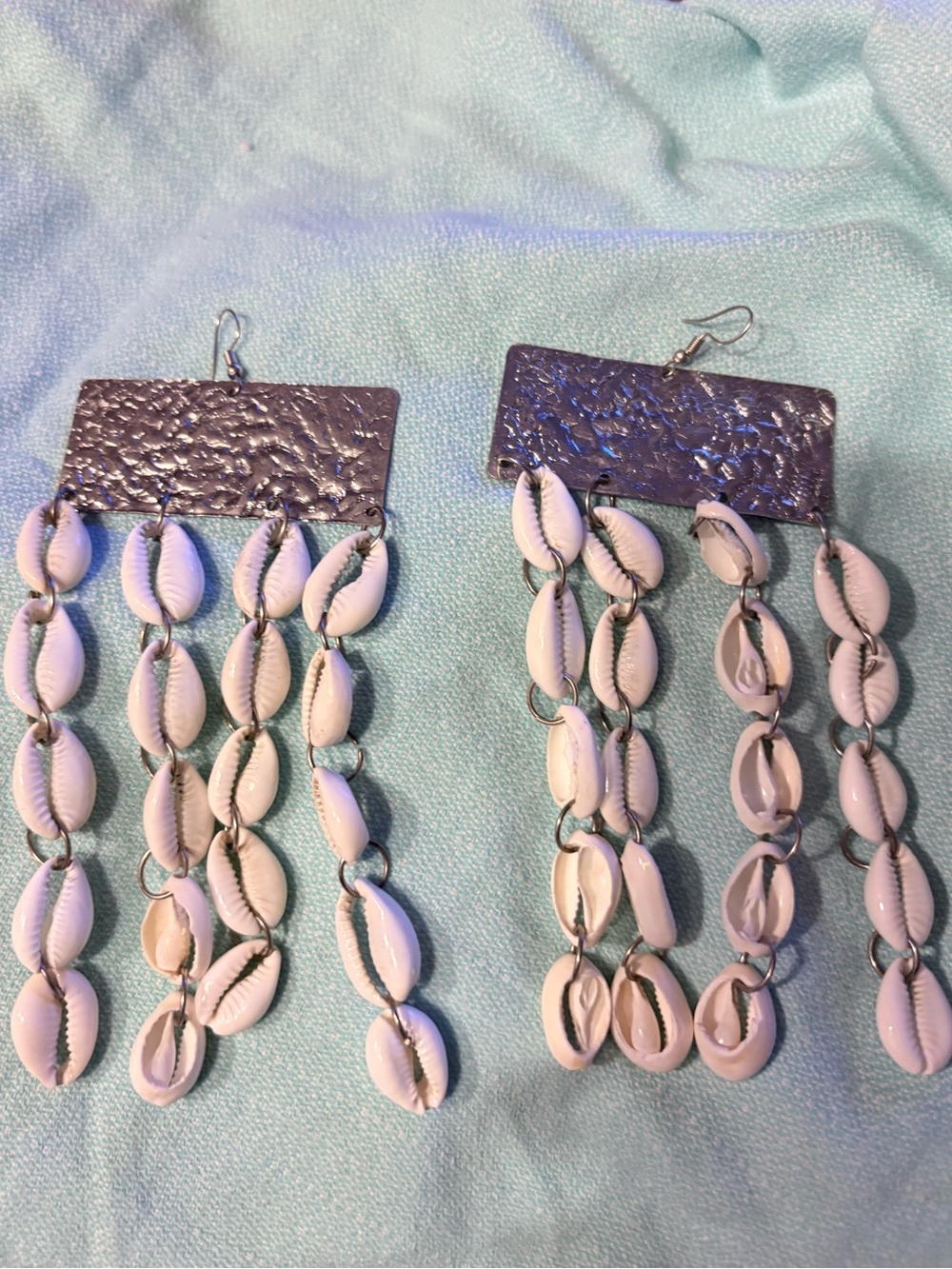 Hammered Metal and Cowrie Shells Drop Earrings.